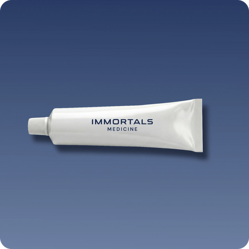 Immortals Medicine topical treatment tube branded Immortals Medicine on a blue background, personalized prescription topical in the Bryan Johnson Blueprint longevity protocol