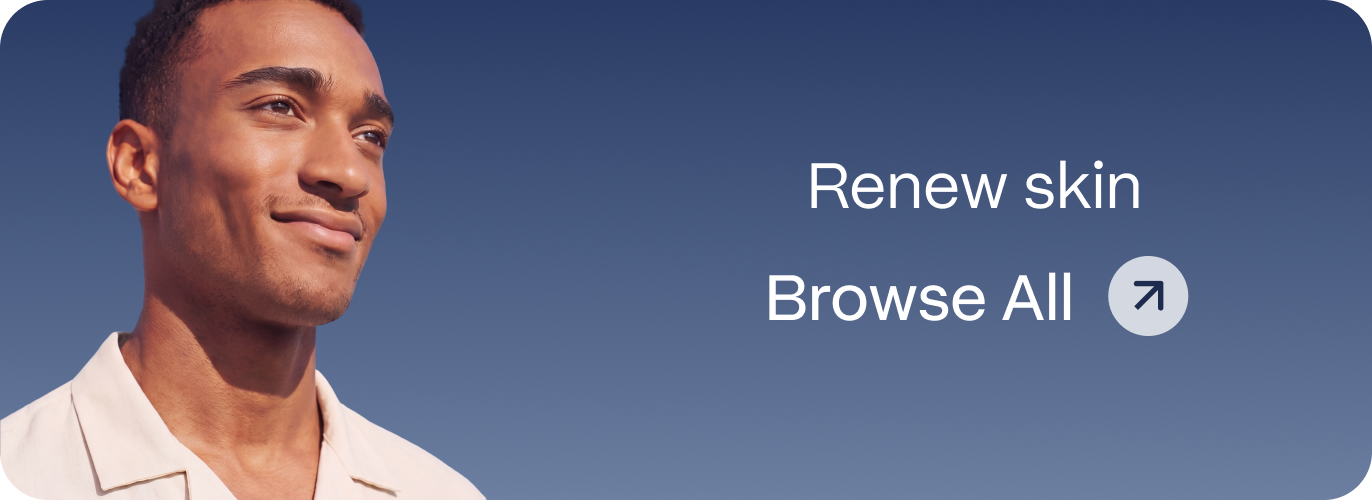 Smiling young man with clear skin in a light collared shirt against a blue sky, representing Blueprint Immortals skin renewal treatments