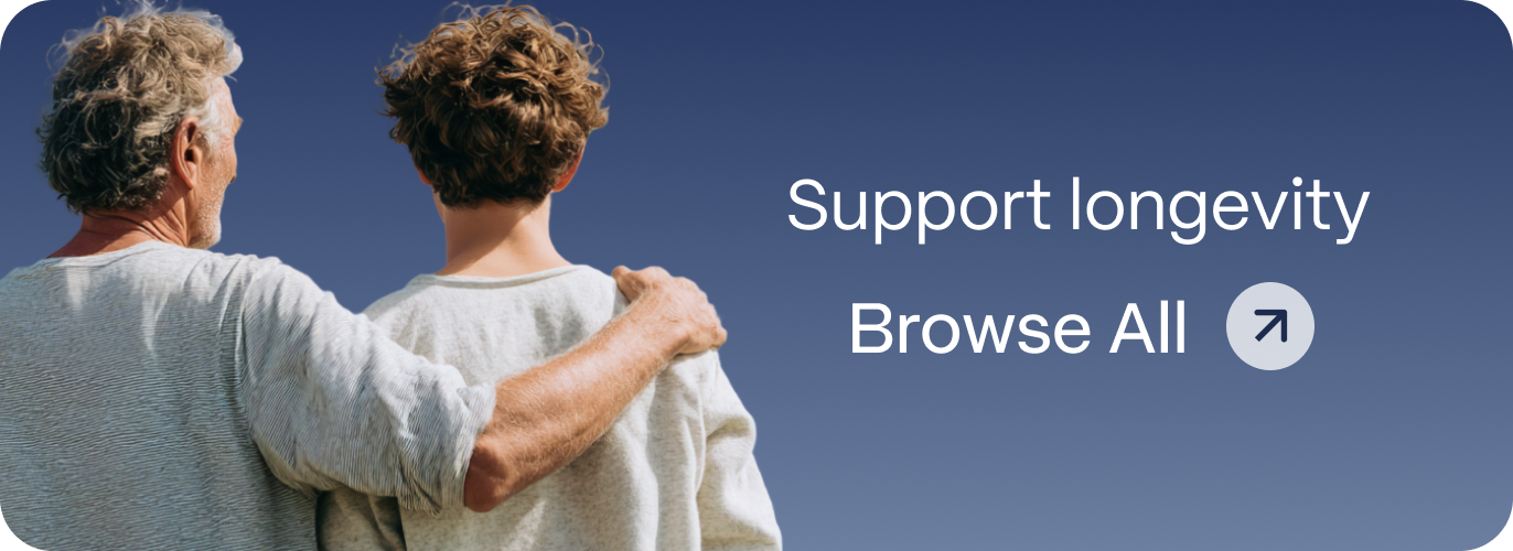 Older and younger man standing arm in arm viewed from behind against a blue sky, representing Blueprint Immortals longevity support treatments