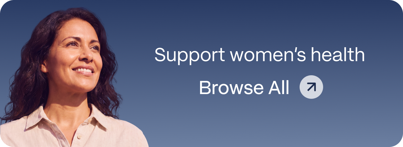 Smiling woman with dark wavy hair in a beige linen shirt against a blue sky, representing Blueprint Immortals women's health treatments