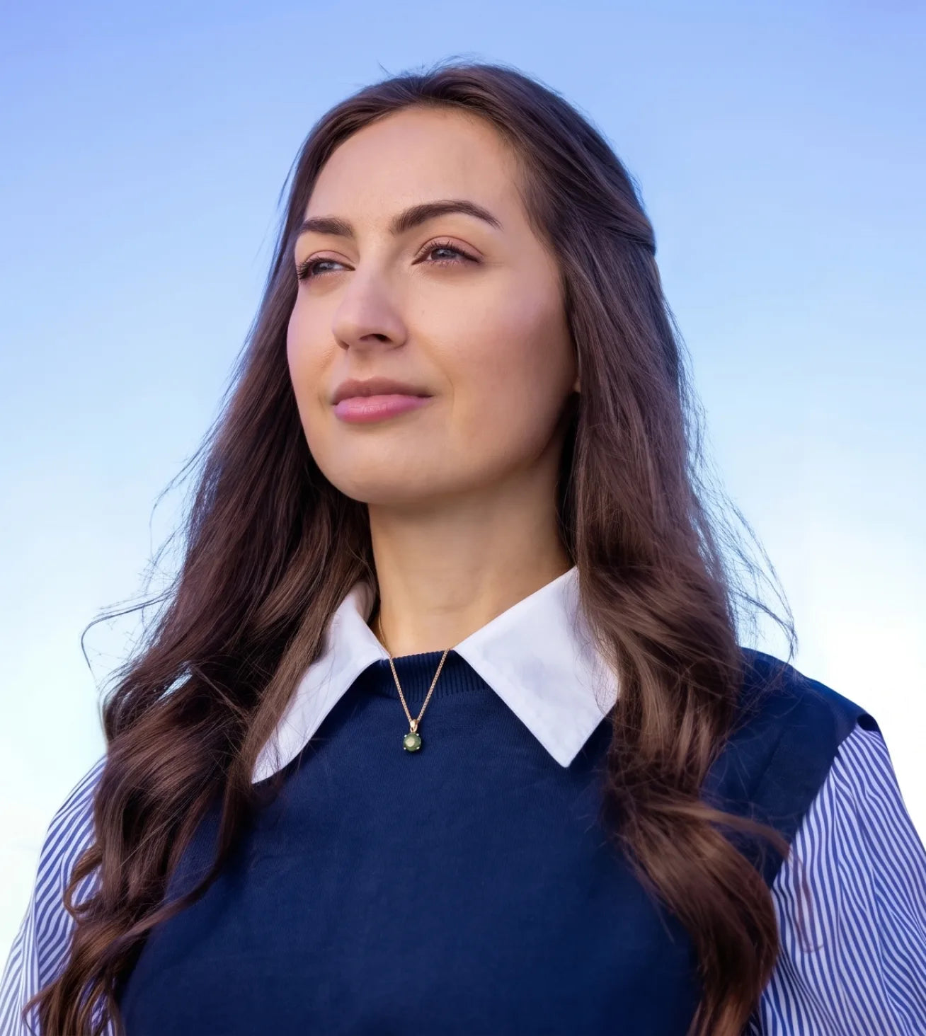 Kate Tolo, Immortals co-founder, outdoors against a blue sky