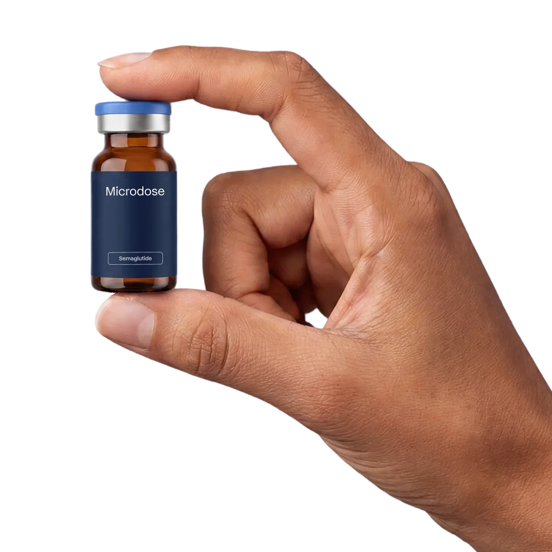 Hand holding a Microdose semaglutide vial